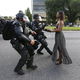 A woman’s peaceful act of resistance during a protest in Baton Rouge, La., became the symbol of a powerful moment in the Black Lives Matter movement. (Credit: Jonathan Bachman/Reuters)